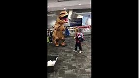 Grandma in T-Rex Costume Greets Family at Toronto Airport