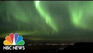 Watch The Green Glow Of The Northern Lights Across The Alaskan Sky | NBC News