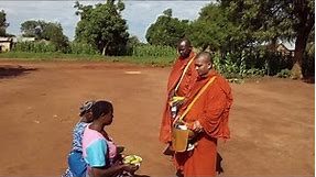 For first time, alms round of Buddhist monks in Uganda, Africa.