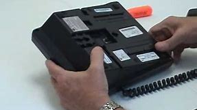 Demonstration of how to turn a desk phone into a wall-mounted phone