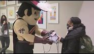 Cleveland Cavs mascot Sir C.C. welcomes incoming passengers at Cleveland Hopkins Airport