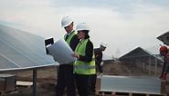 Workers of solar energy plant outdoors - Free Stock Video