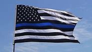School district restricts Thin Blue Line flags after football players carried one to honor coach