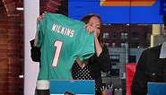 Kay Adams receives the first Miami Dolphins Christian Wilkins jersey