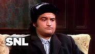 Saturday Night Live’s Very First Sketch: Watch John Belushi Launch SNL in October, 1975