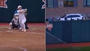 Texas' Joley Mitchell hits a HR off a windshield