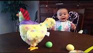 Baby's shocked reaction to an Easter hen laying eggs - "Wanna see it again?"