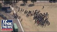 Mass student walkout one month after Parkland, Florida shooting