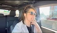 Woman Driving while Smoking and Chatting