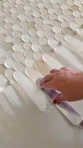 Applying Textured Paste to Create Elegant Scale Patterns on a Surface Using a Professional Spatula