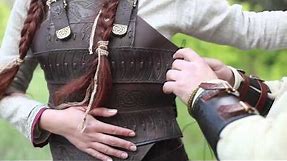 Arming a Viking lady for the battle. "Shieldmaiden" leather armor