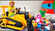 Vlad and Nikita play with toys ride on excavator