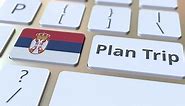 PLAN TRIP Text and Flag of Serbia on the Keyboard