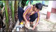 village girl cooks chicken gravy with traditional spices on firewood stove
