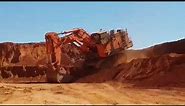 Huge excavator Hitachi EX 5600 downhill