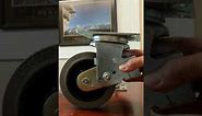 Spring loaded swivel caster with conductive wheel