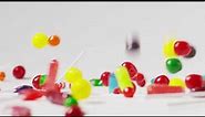 Slow motion close up shot of abundant candy falling and bouncing