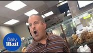 Short man rants at female bagel shop employees before fight