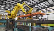 Automated System Uses Robots to Hang Steel I-Beams for Washing & Coating – TranTek Automation