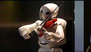 Toyota Robot plays violin.