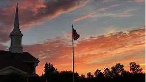 US Flag at church flying at sunrise near Flag Steward HQ