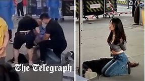 Women pinned to ground and hands tied by Covid security for not wearing mask in China