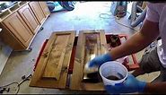 Hand wiping spar varnish on wood