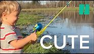Little Boy Catches Fish with Toy Rod