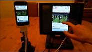 iPhone collegato ad un monitor touchscreen esterno