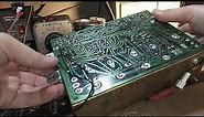 Diagnose and repair a 1960s Magnavox transistor amp with a noisy channel.