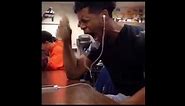 Black guy crying while listening to music