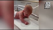 Newborn baby lifts her head and crawls at just 3 days old
