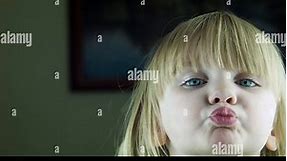 The little cute girl kisses on the camera Stock Video Footage - Alamy