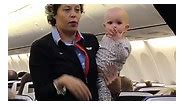 Flight attendant calms infant by taking her on pre-flight preps