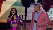 Victoria Justice "wrestles" John Cena during the opening of Teen Choice '16