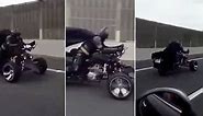 Real-life BATMAN is spotted on 'Batmobile' in Japan