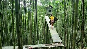 Girl building a tent on top of a bamboo tree- Wild Girl