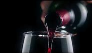 FREE VIDEO FOOTAGE NO COPYRIGHT Pouring red wine from a bottle, very close view