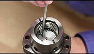 How to reload Ball Bearings into a ball nut. Demonstrated using a nut with button returns