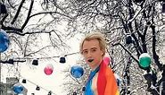 Brave Model Anastasia Harris in the Snow with a Dress & High Heels & a Rainbow Flag