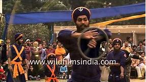 Nihang Sikh warriors display martial skills with weapons