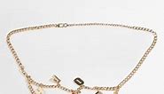 ASOS DESIGN metal chain belt with 'havoc' in gold | ASOS