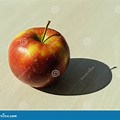 Apple with Shadow On Brown Table