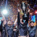 Stock Photo of a eSports Team Holding a Trophy