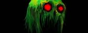 Creepy Green Eyed Monster Face