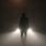 Man Standing in Fog