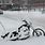 Pushing Motorcycle in Snow