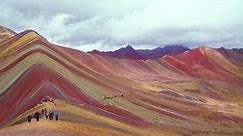 View on one of nature wonders, the Rainbow mountains in Peru with people visitng at 5200 meters