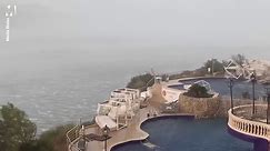 Storm wipes through Majorca and sends pool furniture flying
