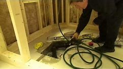 How to install a shower drain in a cement floor